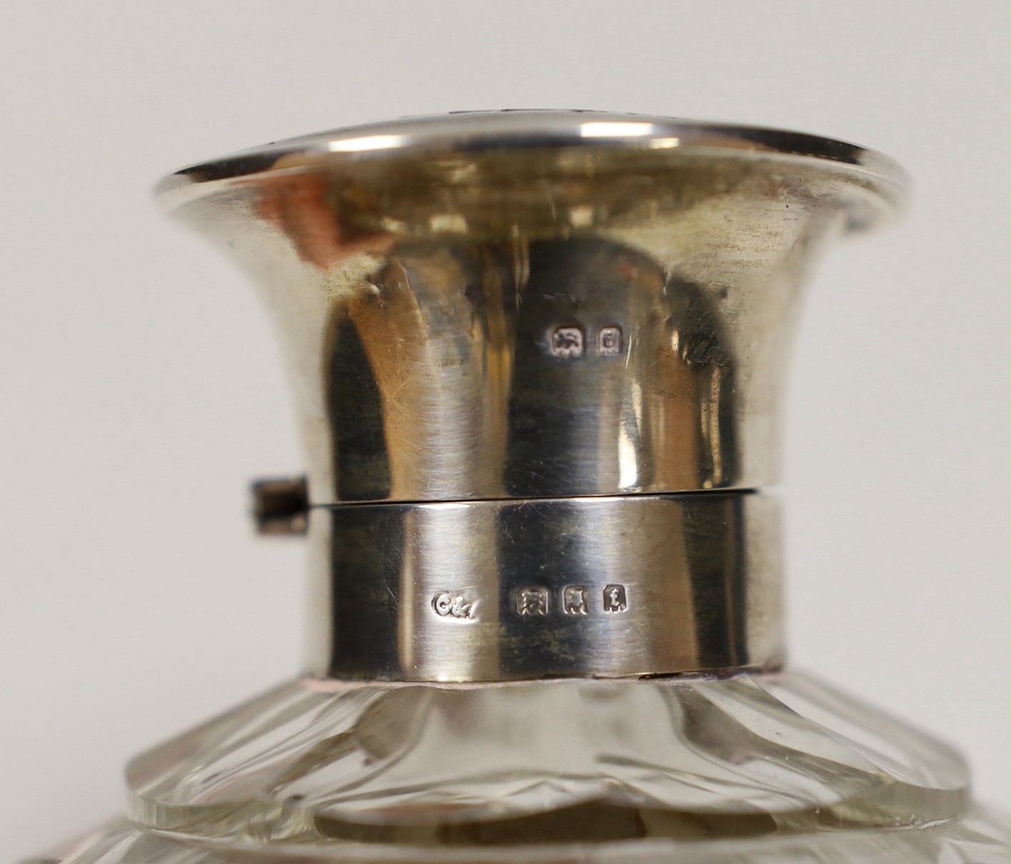 A George V silver and tortoiseshell pique mounted heavy cut glass scent bottle, London, 1921, height 12.5cm.